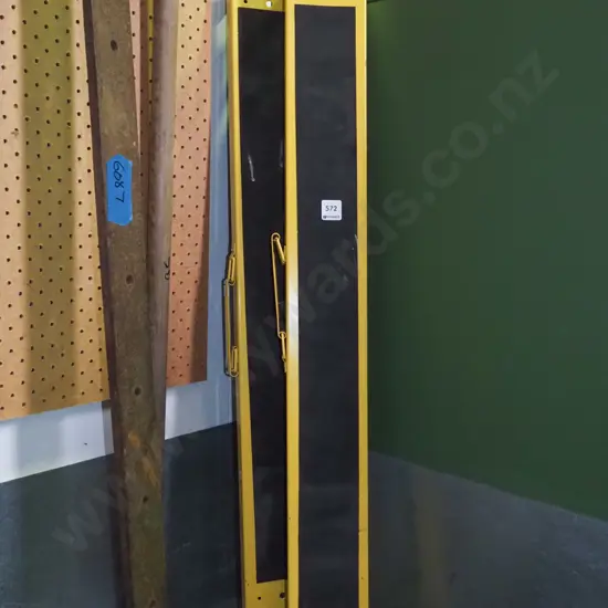 pair of yellow foldaway saw horses