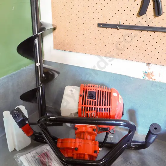 Tool Shed branded as new post hole borer with 1 auger