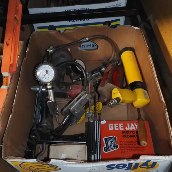 box; bottle jack, air powered caulking gun, tyre pressure gauge etc