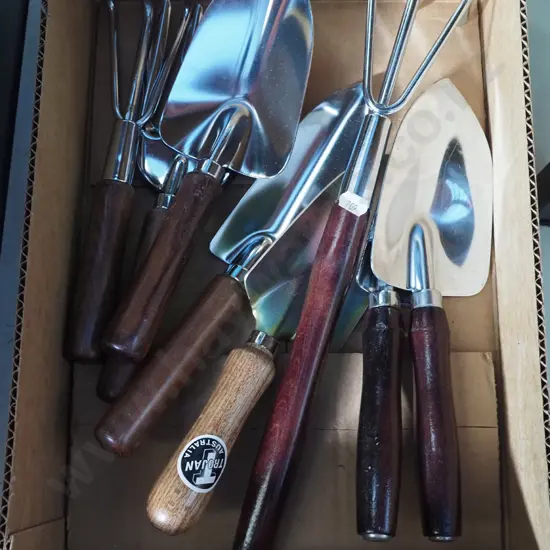 box of wood handled garden tools