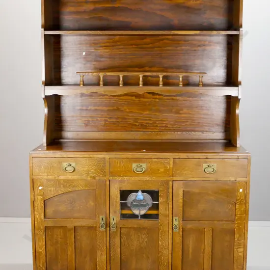 oak dresser with arts & crafts base and more modern added open-top section - 3 drawers over 3 panelled doors with brass