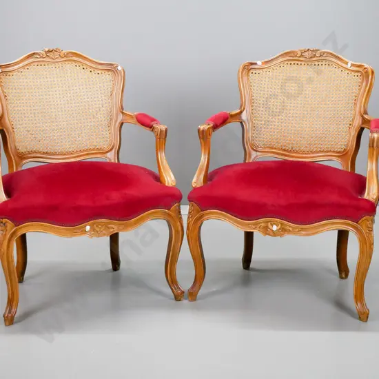 vintage reproduction French style open-armed armchairs with woven cane back, carved arms and legs H830 W620 D560