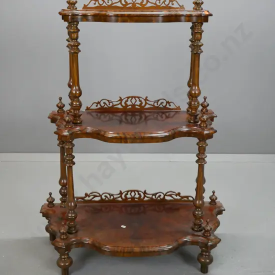 Victorian style walnut veneer 3-tier whatnot with turned supports and finials, pierced galleries, on squat turned feet
