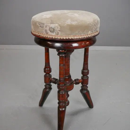 Edwardian dark-stained revolving top piano stool on turned column & 3 turned legs - borer holes in seat plate, some wear