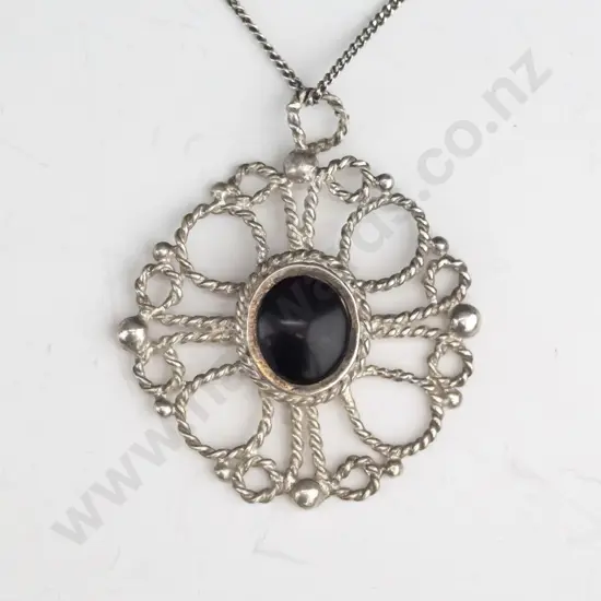 silver necklace with black stone stamped silver