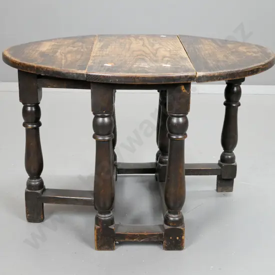 vintage oak small oval gate-leg table on turned bolster shaped legs. Surface wear and scratches to top H-460 L-720 W-550