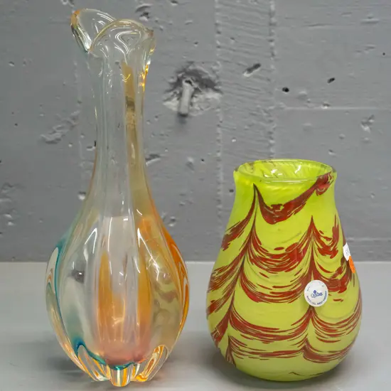 2 pieces of art glass - green and red swirl vase with Oglebay West Virginia label and a fluted bottle vase with light