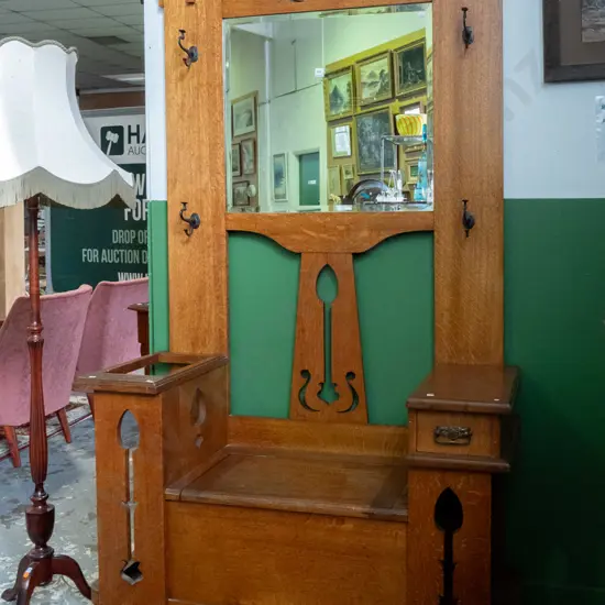 arts & crafts style oak hall stand with bevelled edge mirror, metal coat hooks, pierced decoration, umbrella stand with