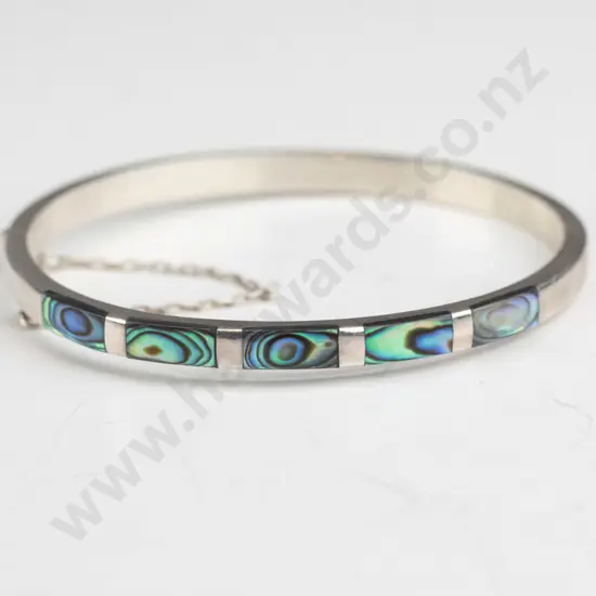 silver bangle with paua shell and safety chain