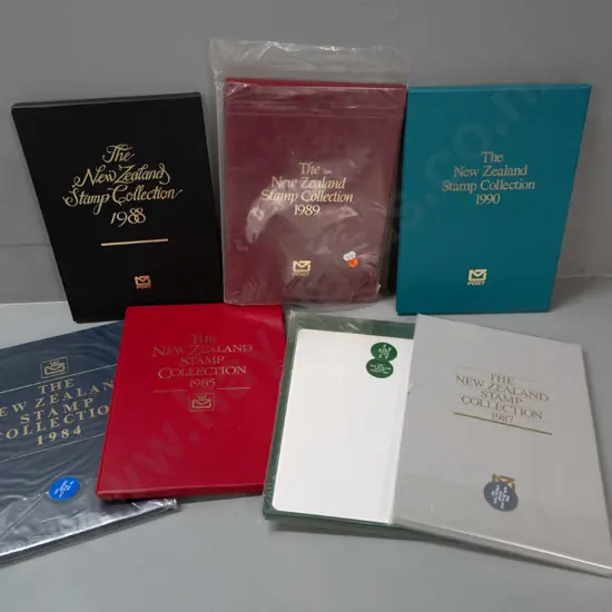 7 New Zealand annual stamp collector's albums - 1984 thru 1990, 3 still sealed