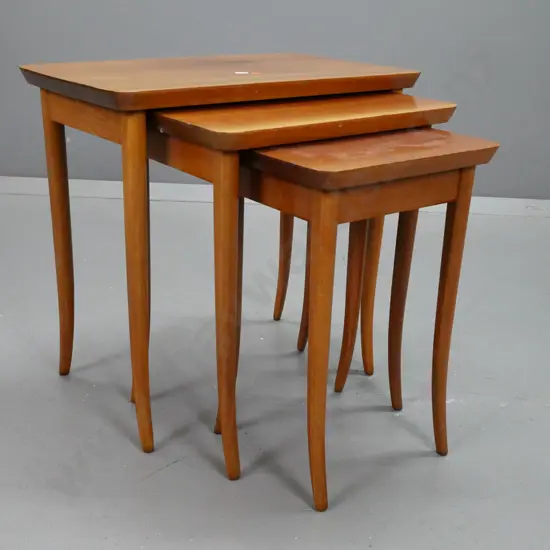retro set of 3 mahogany nesting tables on sweeping legs - fading to tops, small one has mark pattern from protective