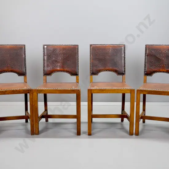 4 vintage oak stretcher base dining chairs with embossed leather seat and back, metal stud edging - some wear to leather