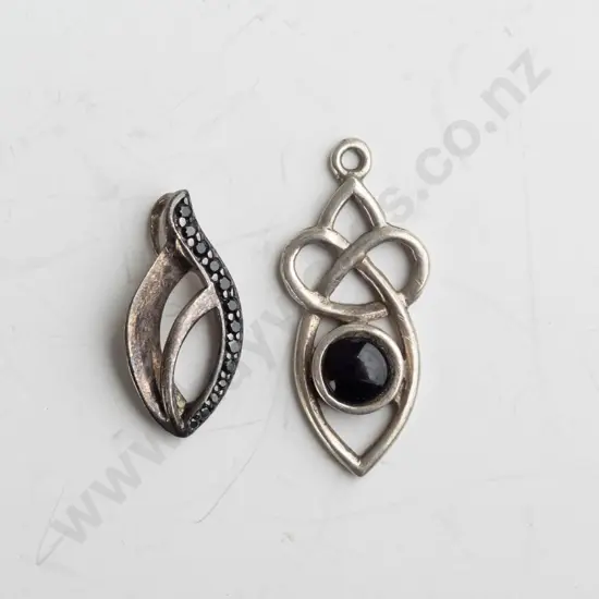 2 silver pendants both stamped 925 & no chains
