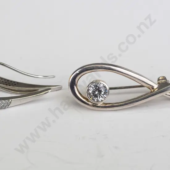 silver brooch with cz stamped 925 & pair of silver earrings no mark