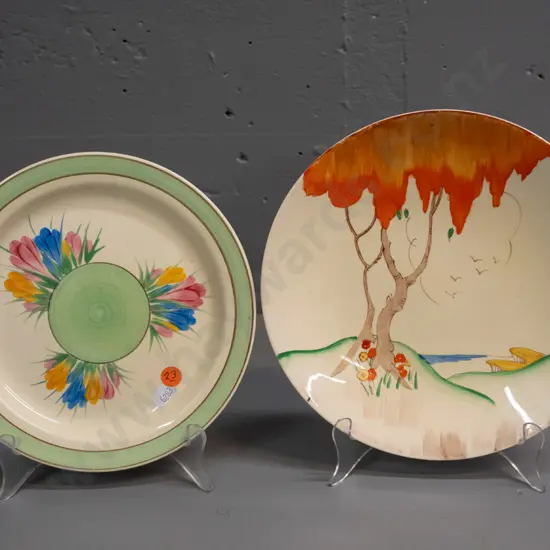 2 Clarice Cliff plates - Newport Pottery crocus design and Wilkinson tree pattern with some slight staining D-230