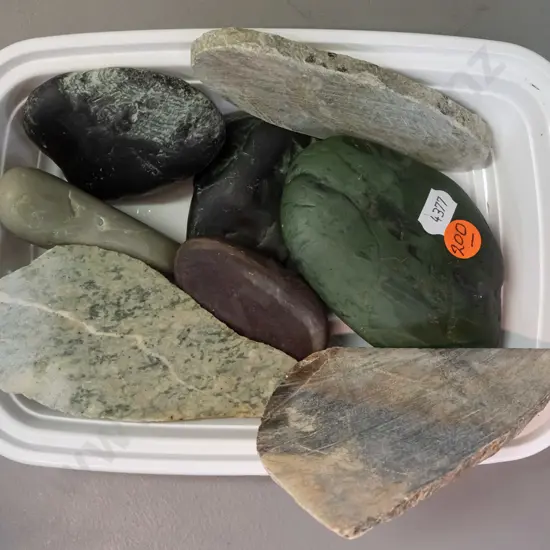 8 pieces of stone, some cut, all were marked greenstone - large dark green piece L-150