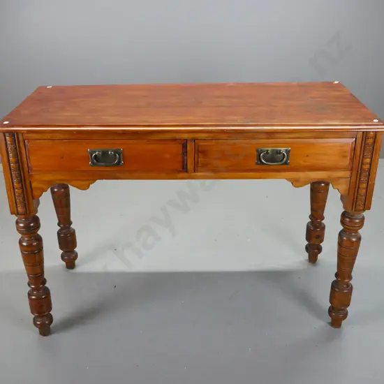restored Edwardian 2-drawer desk with press-carved decoration, turned legs - has filled holes in legs from removed