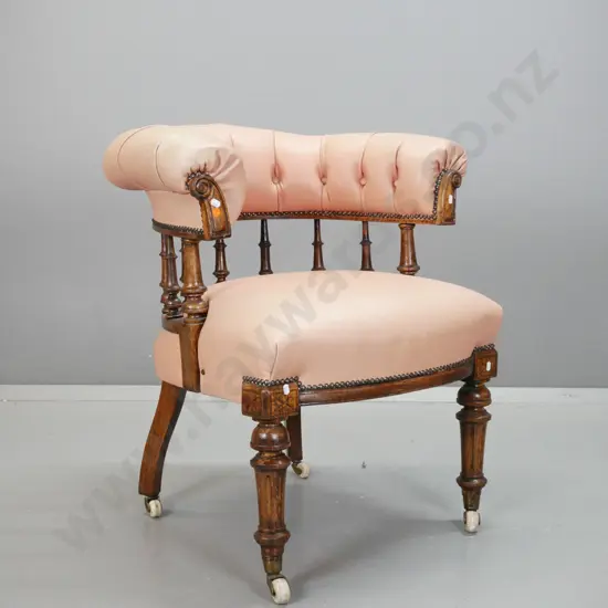 Victorian oak tub chair with turned spindles, turned & fluted legs on porcelain casters, pleated and buttoned leather