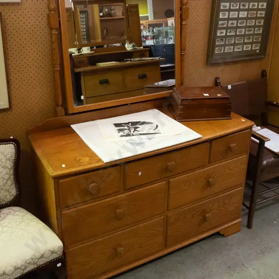 reproduction oak mirror-back 7-drawer chest with timber knobs, on bracket feet, w/adjustable mirror. Some desilvering to