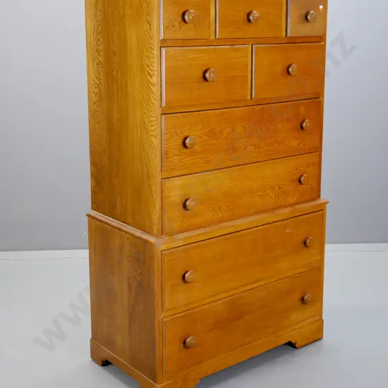 reproduction oak 9-drawer chest-on-chest with turned timber knobs, on bracket feet. H-1530 W-900 D-490