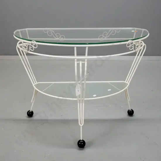 mid-century half round painted metal based table with glass top, lower shelf with textured glass, metal ball feet H-500