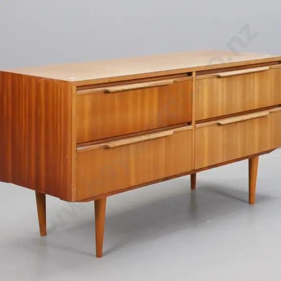 retro NZ made mahogany veneer 4-drawer lowboy with rimu drawers, tapered turned legs - some fading and staining to
