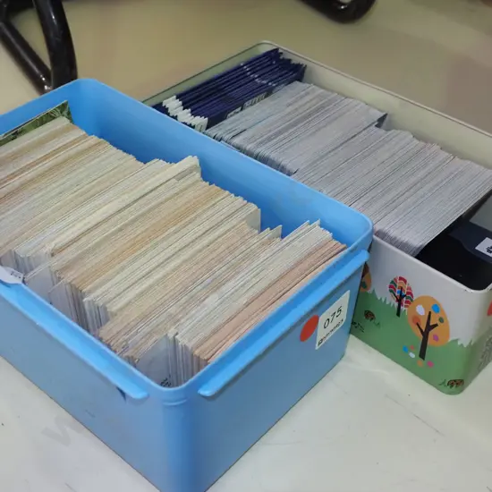 2x containers of collector cards - red dots