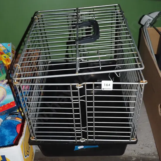 small plastic and metal pet crate