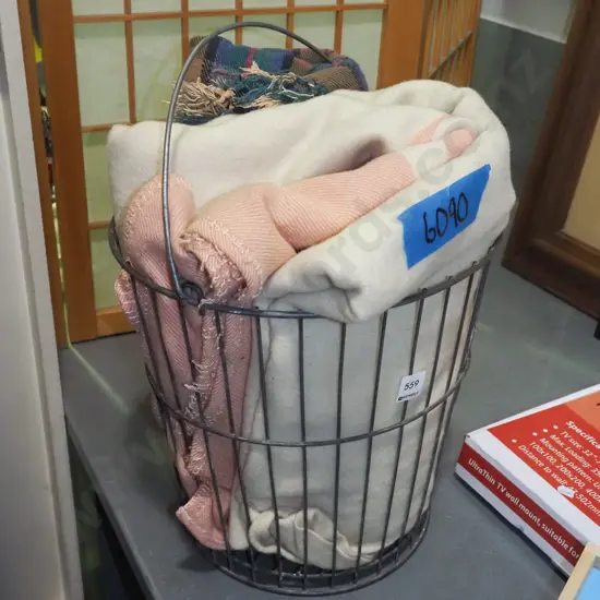 wire basket, woollen blankets