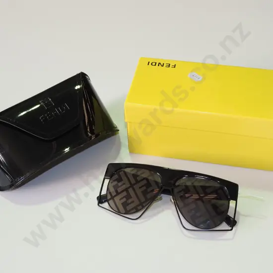 pair of novelty sunglasses in yellow box and case