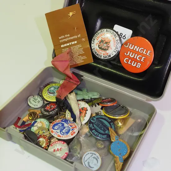 small plastic lidded box of various badges