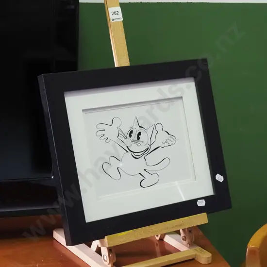 framed Felix the Cat print on small easel