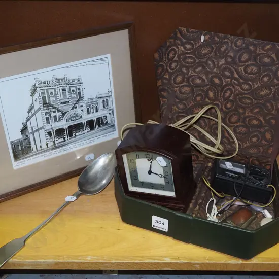 shelf; large serving spoon, reproduction Dunedin photo, small clock, volt tester etc