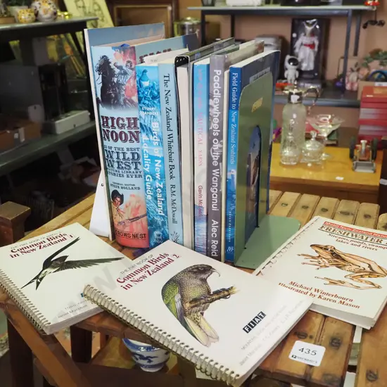 various books and metal bookends