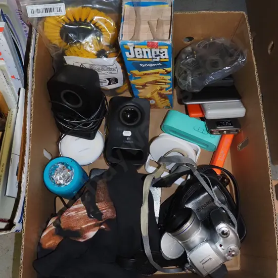 box; Jenga, calculator, computer speakers, Beatles T shirt etc
