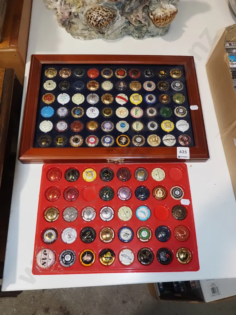 2x tray of various champagne bottle tops Image 1++