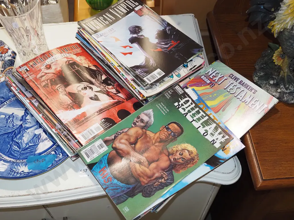 stack of various graphic novels Image 1++