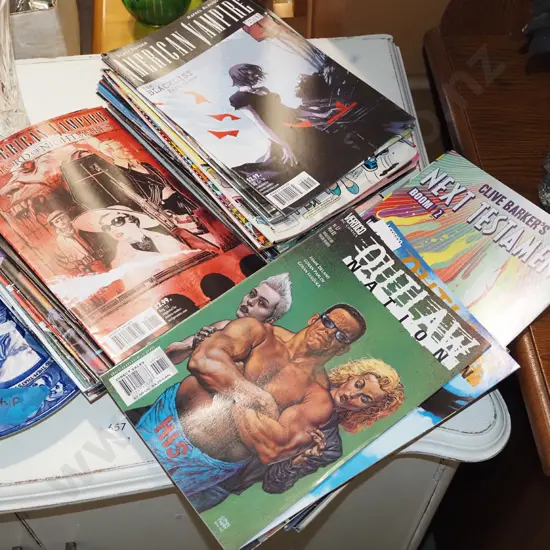 stack of various graphic novels