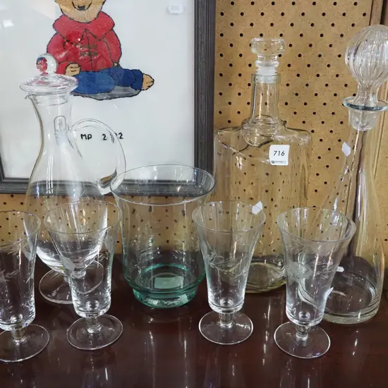 3 stoppered decanters, etched glasses, vase