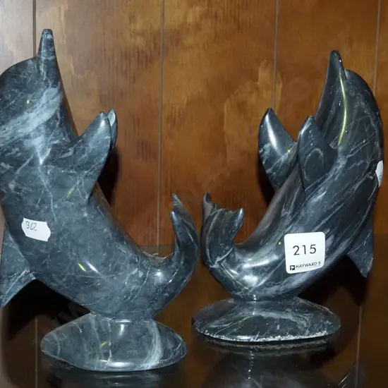 pair of carved stone dolphins H-180