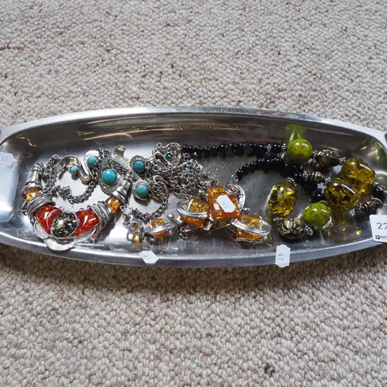 stainless steel tray; costume necklaces