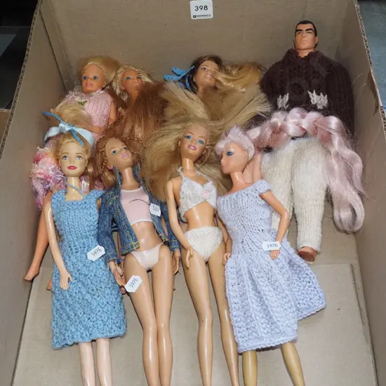 box of Barbie and other dolls