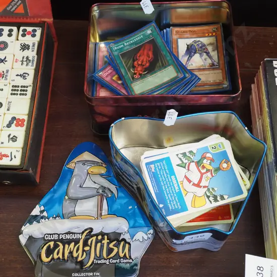 2x tins of collector cards