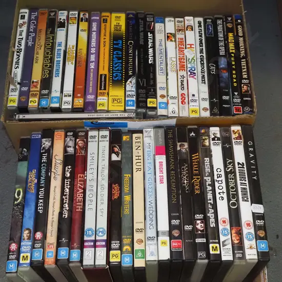 2x boxes of DVDs - red dots