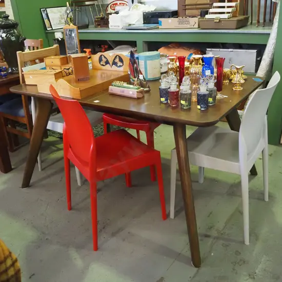 contemporary dark stained dining table with 4 grey and red plastic chairs H-770 W-1500 D-900