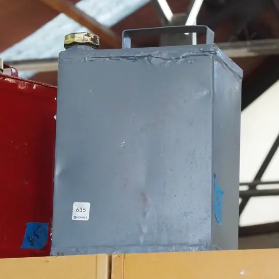 grey painted petrol can with polished brass top