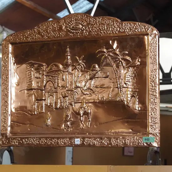 polished beaten copper firescreen