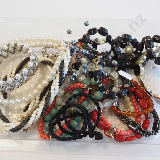 plastic tray ; necklaces, bracelets