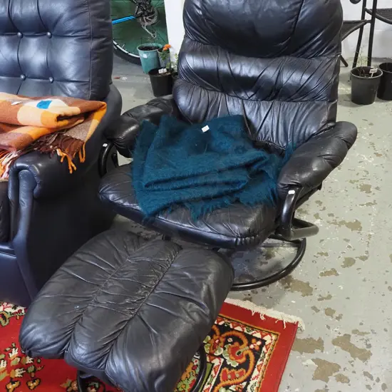 black vinyl swivel chair with footstool - rips and wear