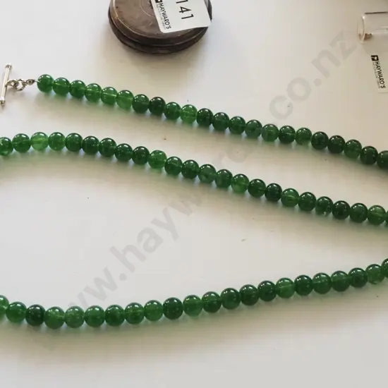 green beaded glass necklace and bracelet